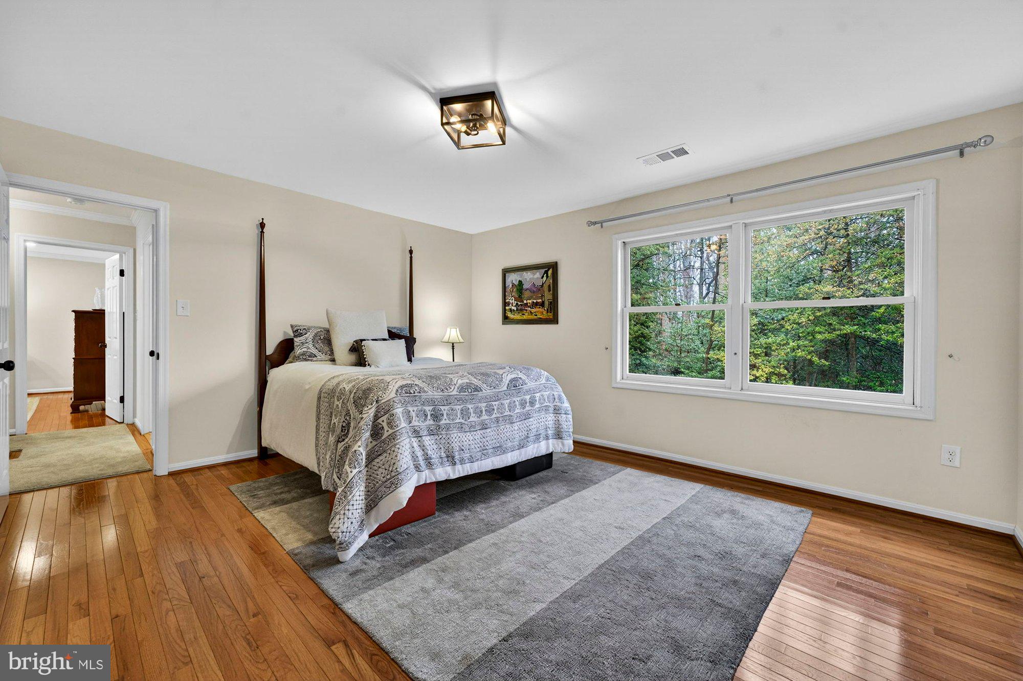 930 Park Street Vienna, VA 22180 - Photo 49 of 83 a bedroom with a bed lamp and a large window