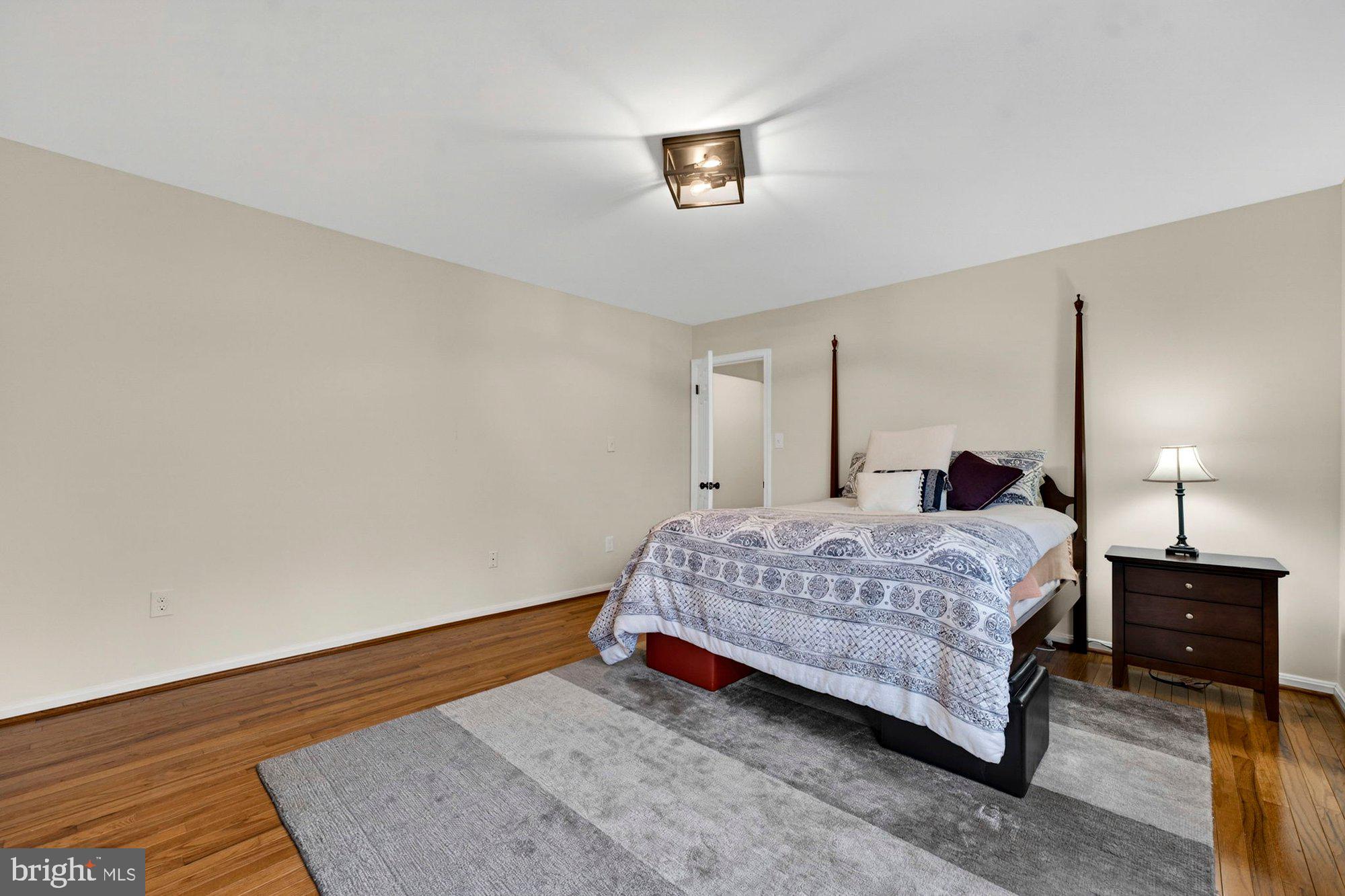 930 Park Street Vienna, VA 22180 - Photo 50 of 83 a bedroom with a bed and a night stand