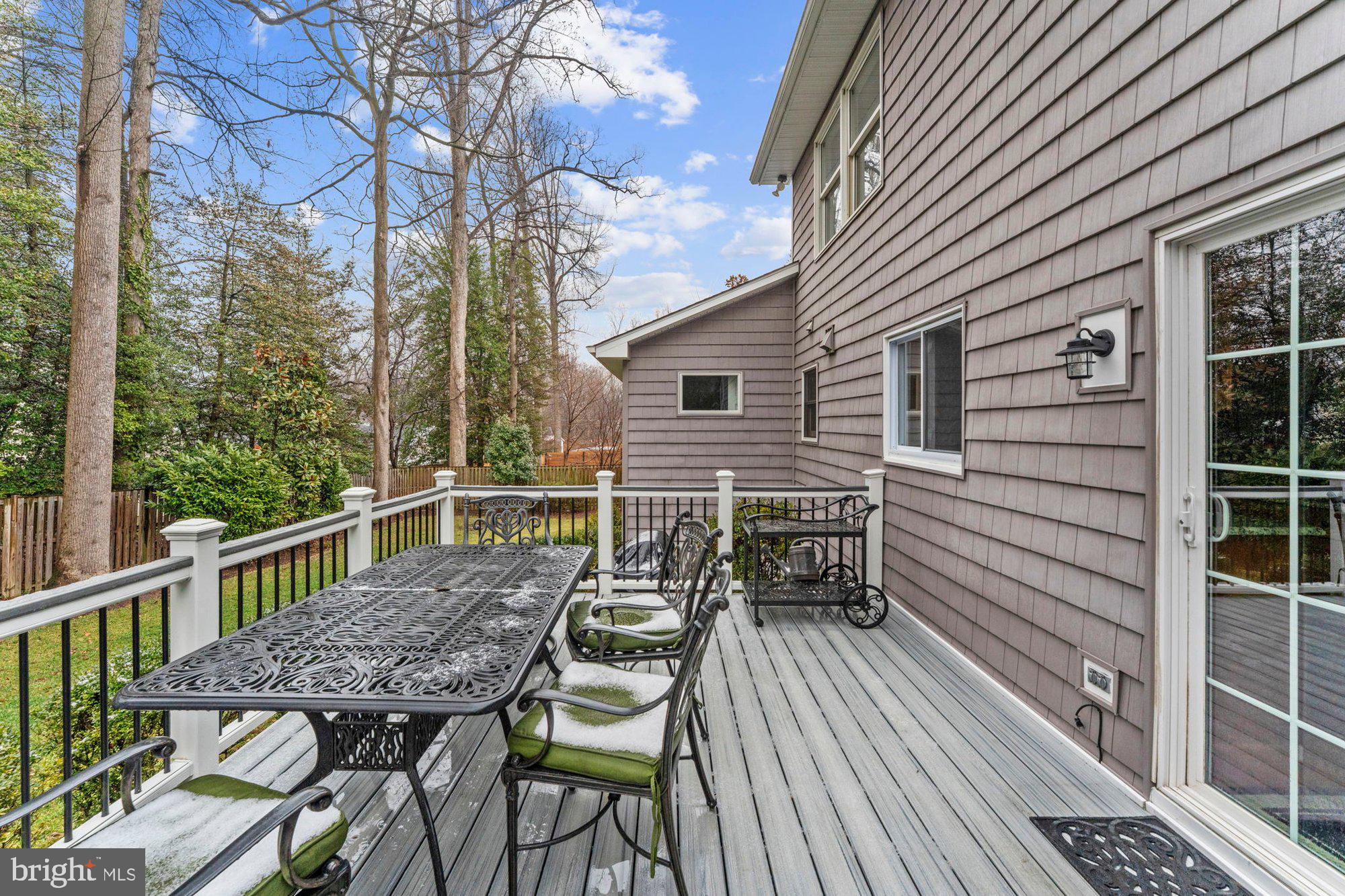 930 Park Street Vienna, VA 22180 - Photo 73 of 83 a view of a roof deck with table and chairs and wooden floor