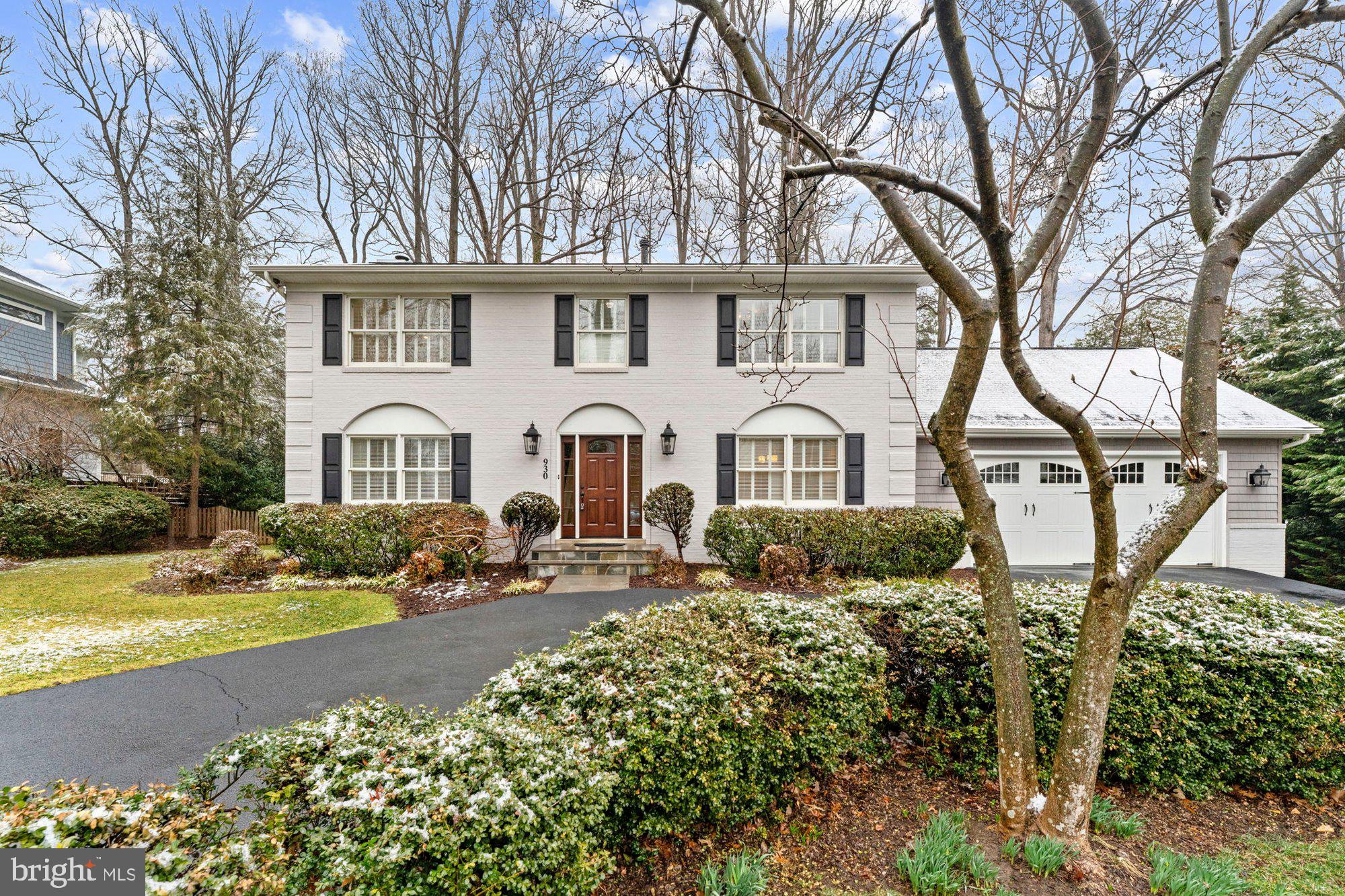 930 Park Street Vienna, VA 22180 - Photo 82 of 83 a view of a white house with large trees and flower plants