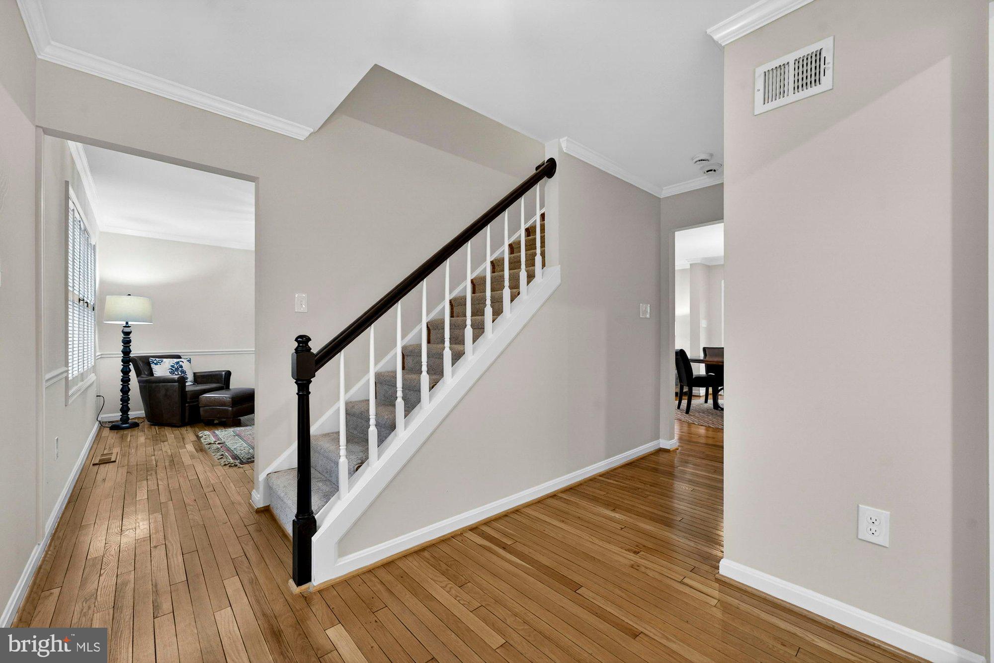 930 Park Street Vienna, VA 22180 - Photo 9 of 83 a view of a hallway with wooden floor and staircase