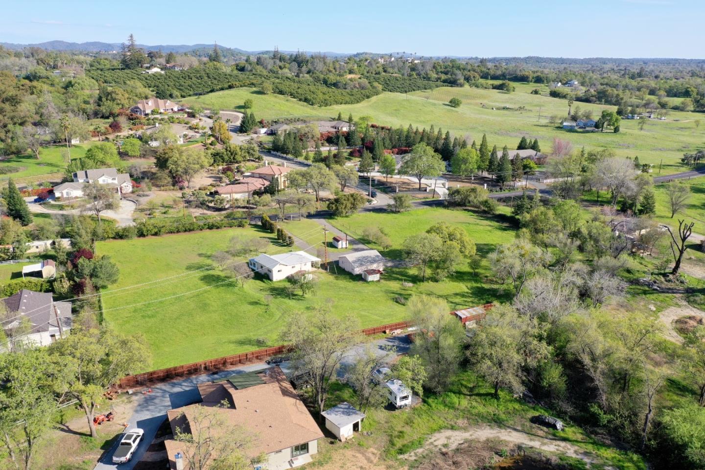 2126 Swetzer Road Penryn, CA 95663 - Photo 8 of 14 an aerial view of green landscape with trees houses and lake view