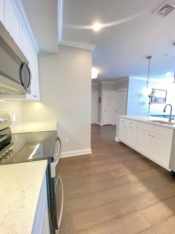 635 Old Post Road, Unit 2203 Sharon, MA 02067 - Photo 12 of 40 a room with a sink and a mirror