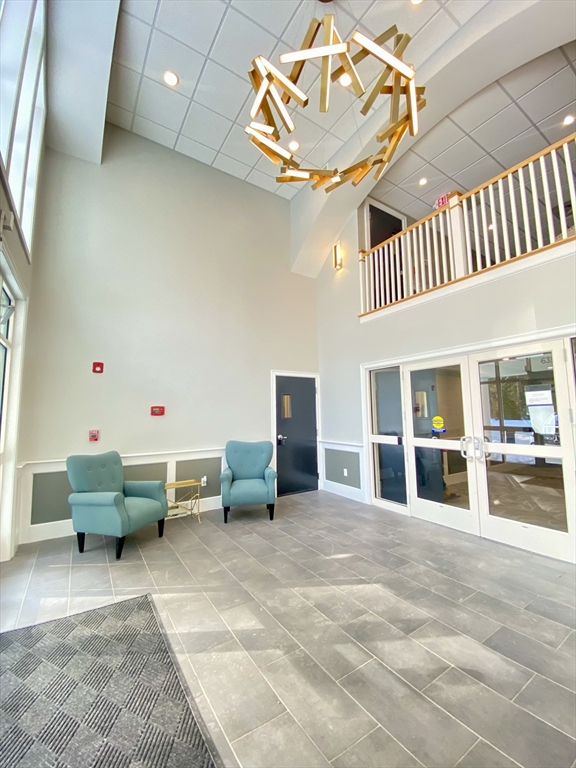 635 Old Post Road, Unit 2203 Sharon, MA 02067 - Photo 2 of 40 a living room with furniture