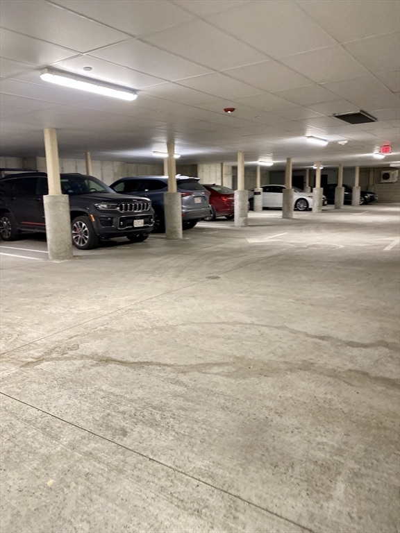 635 Old Post Road, Unit 2203 Sharon, MA 02067 - Photo 28 of 40 a view of parking space with lots of cars parked