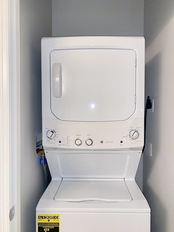 635 Old Post Road, Unit 2203 Sharon, MA 02067 - Photo 39 of 40 a utility room with dryer and washer