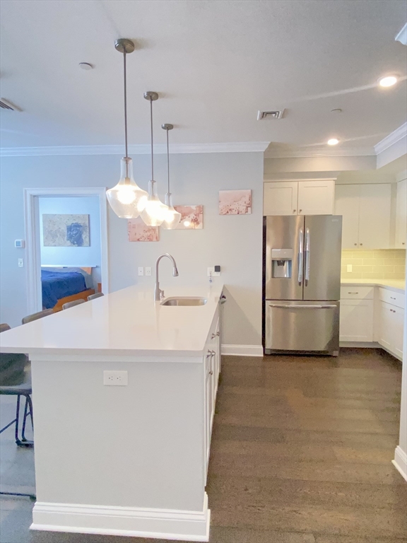 635 Old Post Road, Unit 2203 Sharon, MA 02067 - Photo 4 of 40 a kitchen with refrigerator and countertop