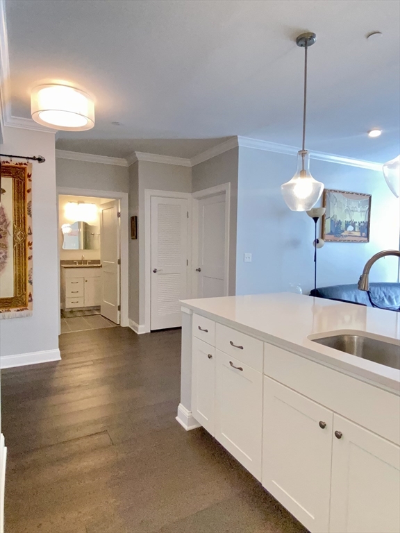 635 Old Post Road, Unit 2203 Sharon, MA 02067 - Photo 9 of 40 a kitchen with cabinets and window