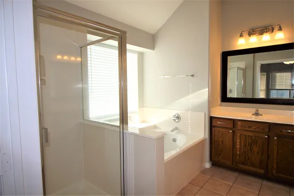 a bathroom with a bathtub and a sink