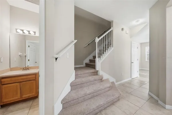 a view of entryway and hall with a sink