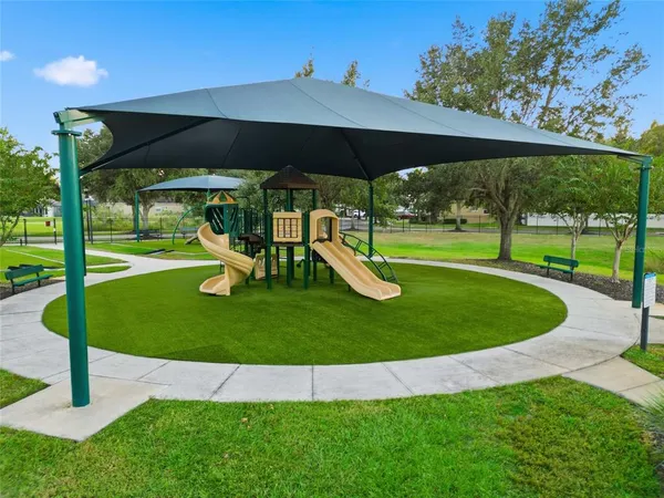 a view of a park with a slide