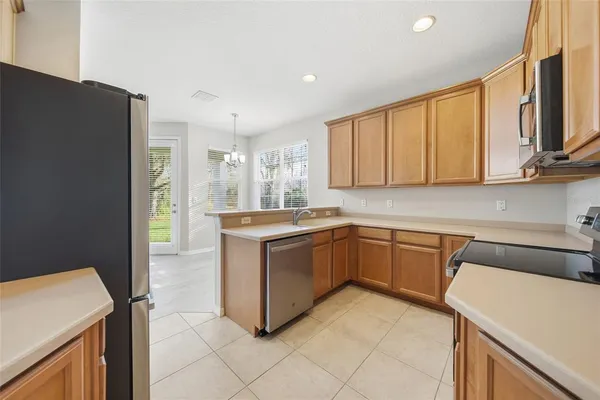 a kitchen with a sink cabinets and window