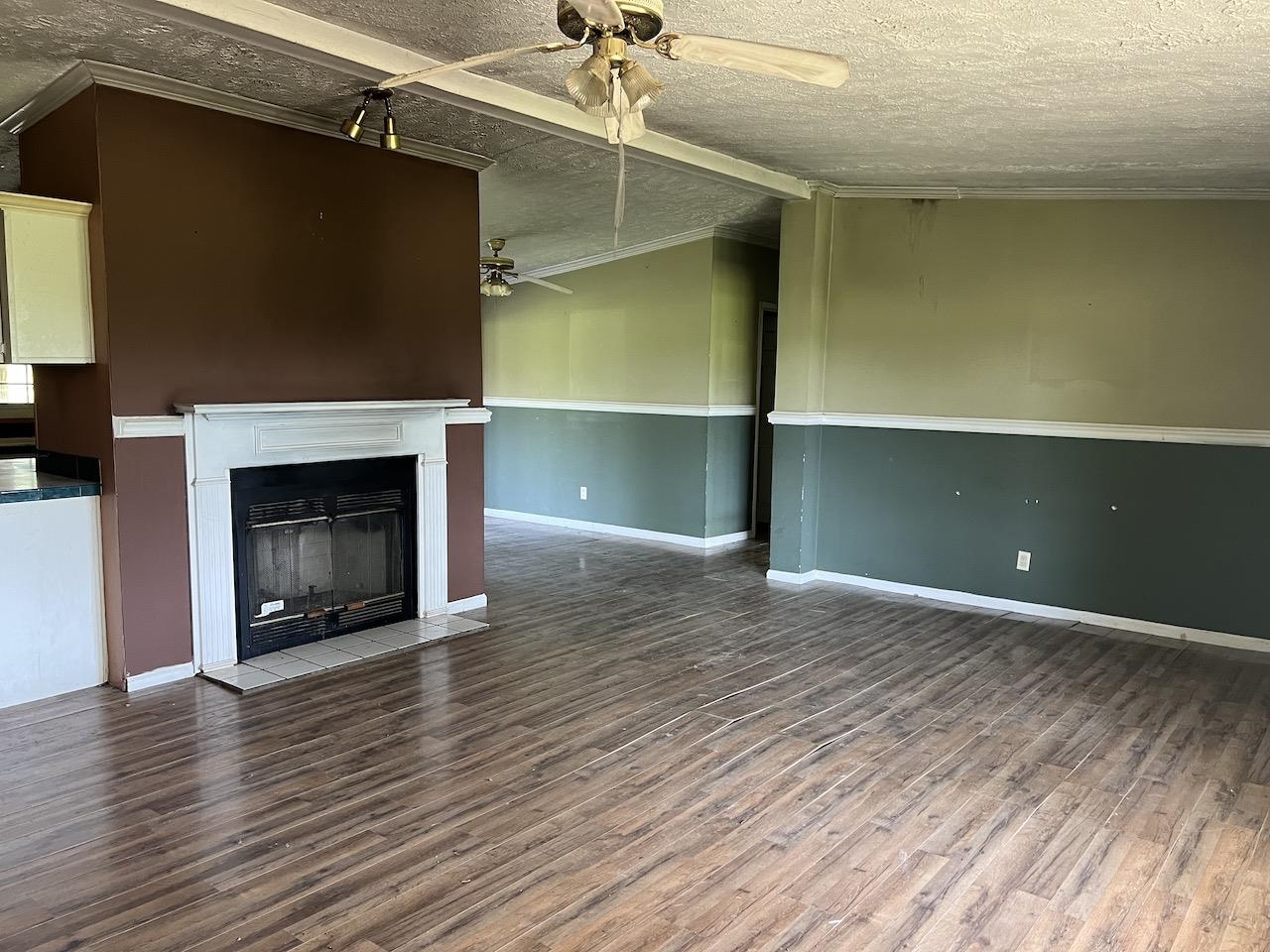 760 Wadsworth Road Henning, TN 38041 - Photo 13 of 15 a view of an empty room with a fireplace and a window