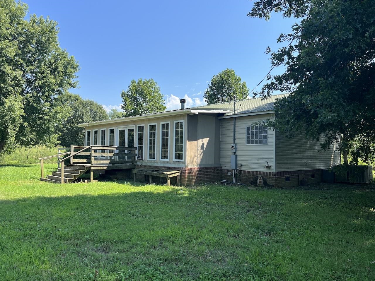 760 Wadsworth Road Henning, TN 38041 - Photo 4 of 15 a view of a house with a yard porch and sitting area