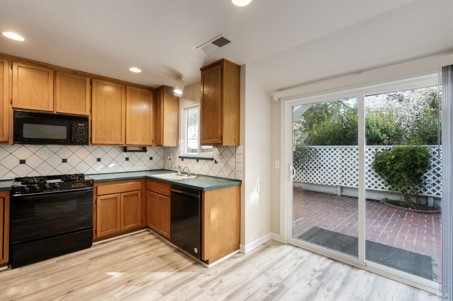 2322 Lakeview Drive Santa Rosa, CA 95405 - Photo 6 of 47 Kitchen with patio access.