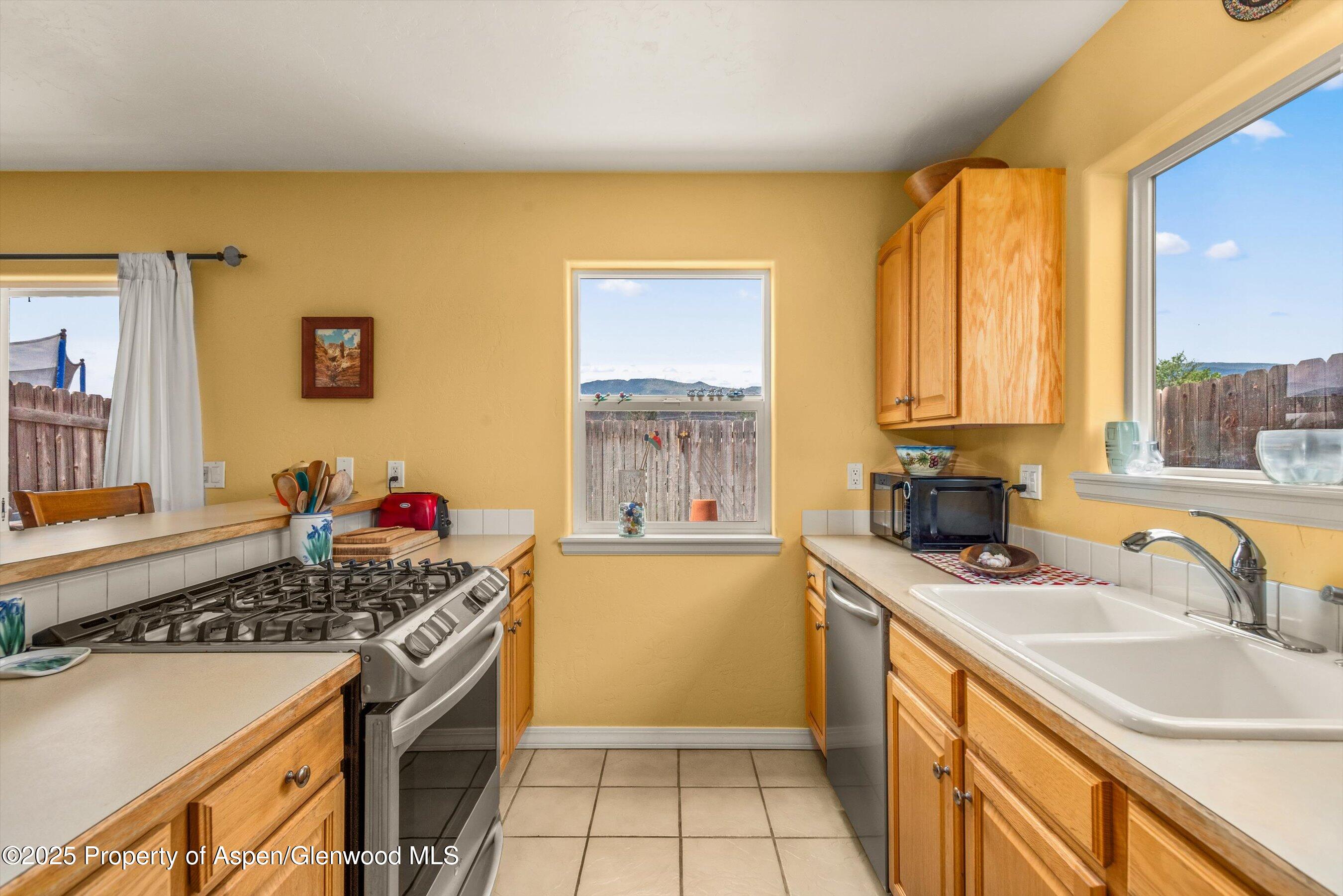1070 Village Road Carbondale, CO 81623 - Photo 14 of 30 a kitchen that has a sink and a stove