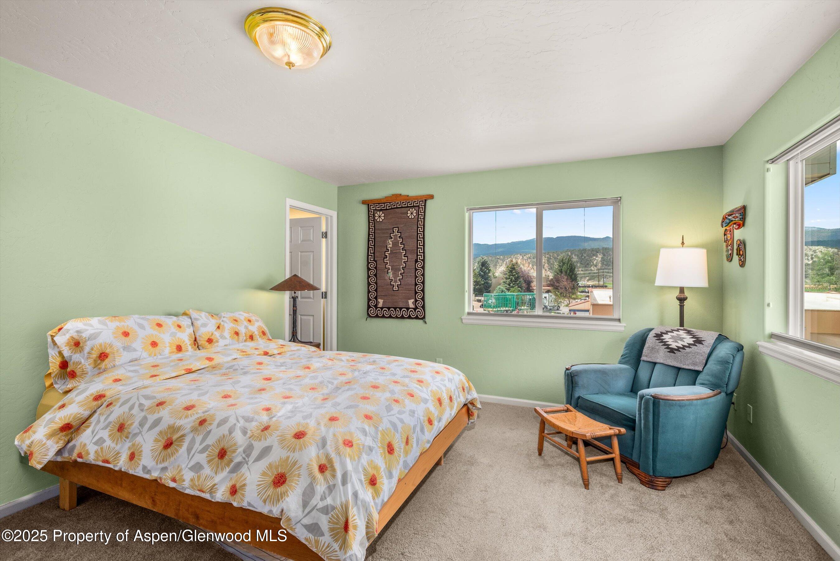 1070 Village Road Carbondale, CO 81623 - Photo 21 of 30 a bedroom with a bed and window