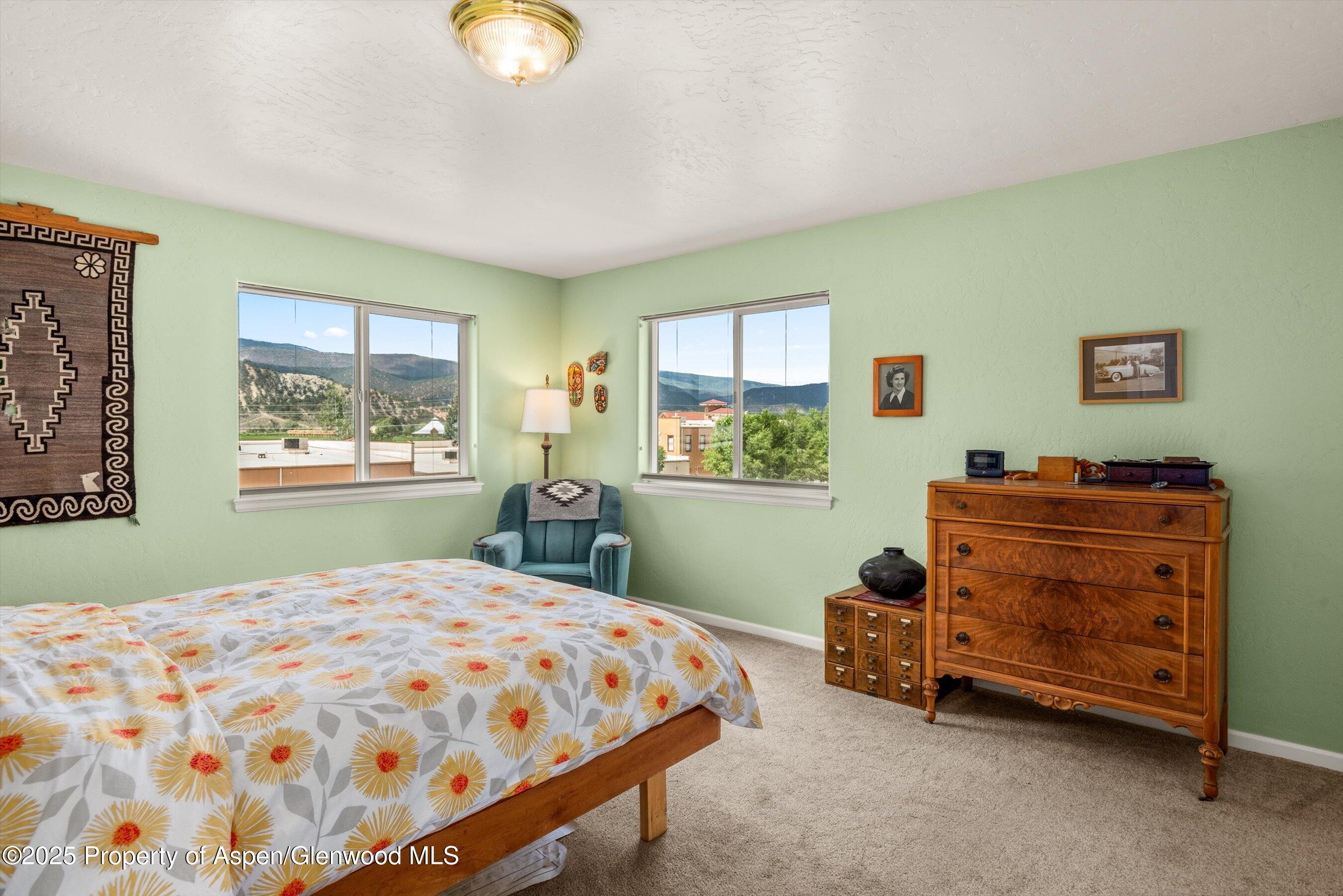 1070 Village Road Carbondale, CO 81623 - Photo 22 of 30 a bedroom with a bed and a window