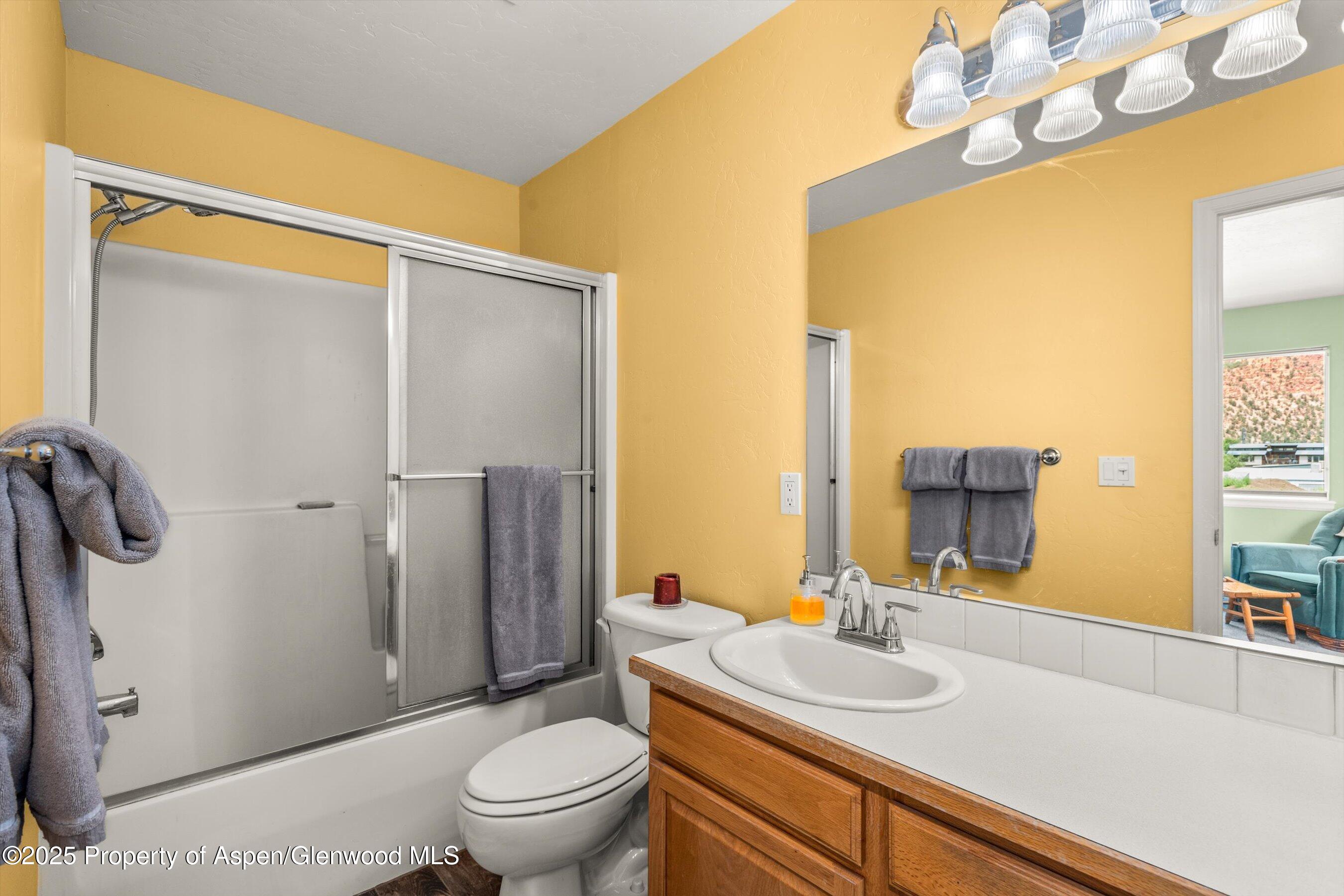 1070 Village Road Carbondale, CO 81623 - Photo 23 of 30 a bathroom with a sink toilet and shower