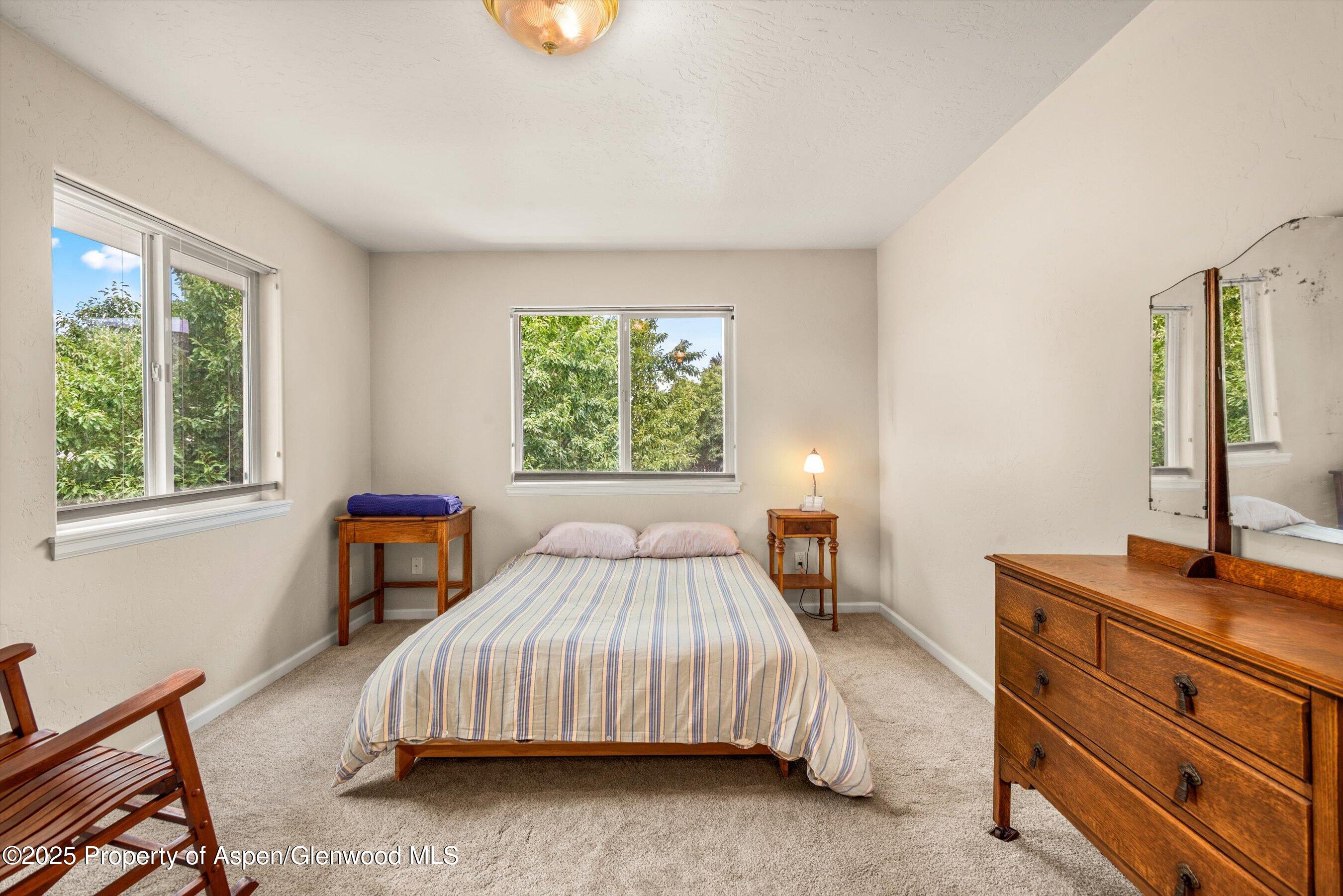 1070 Village Road Carbondale, CO 81623 - Photo 24 of 30 a bedroom with a bed and window