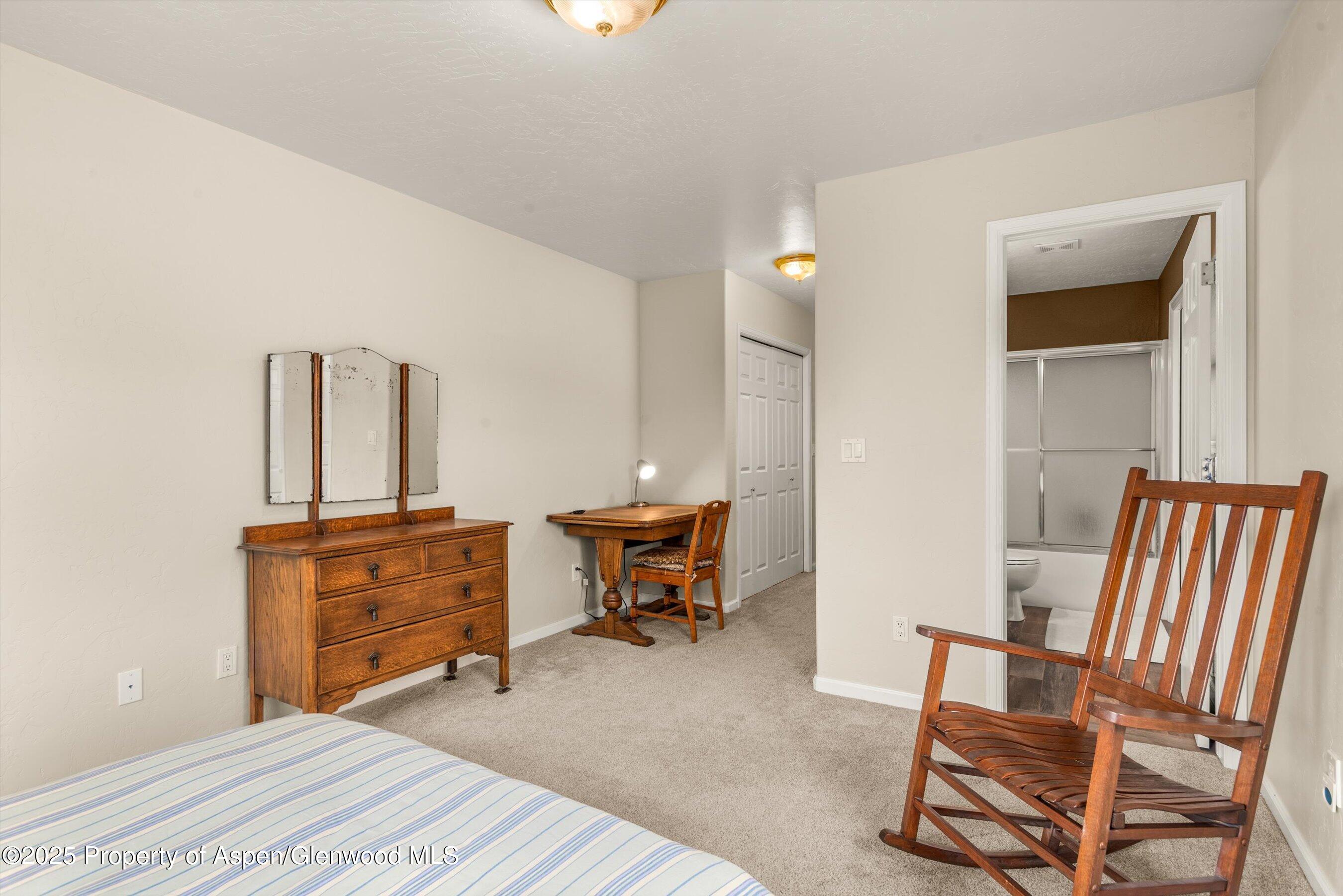 1070 Village Road Carbondale, CO 81623 - Photo 25 of 30 a bedroom with a bed and furniture