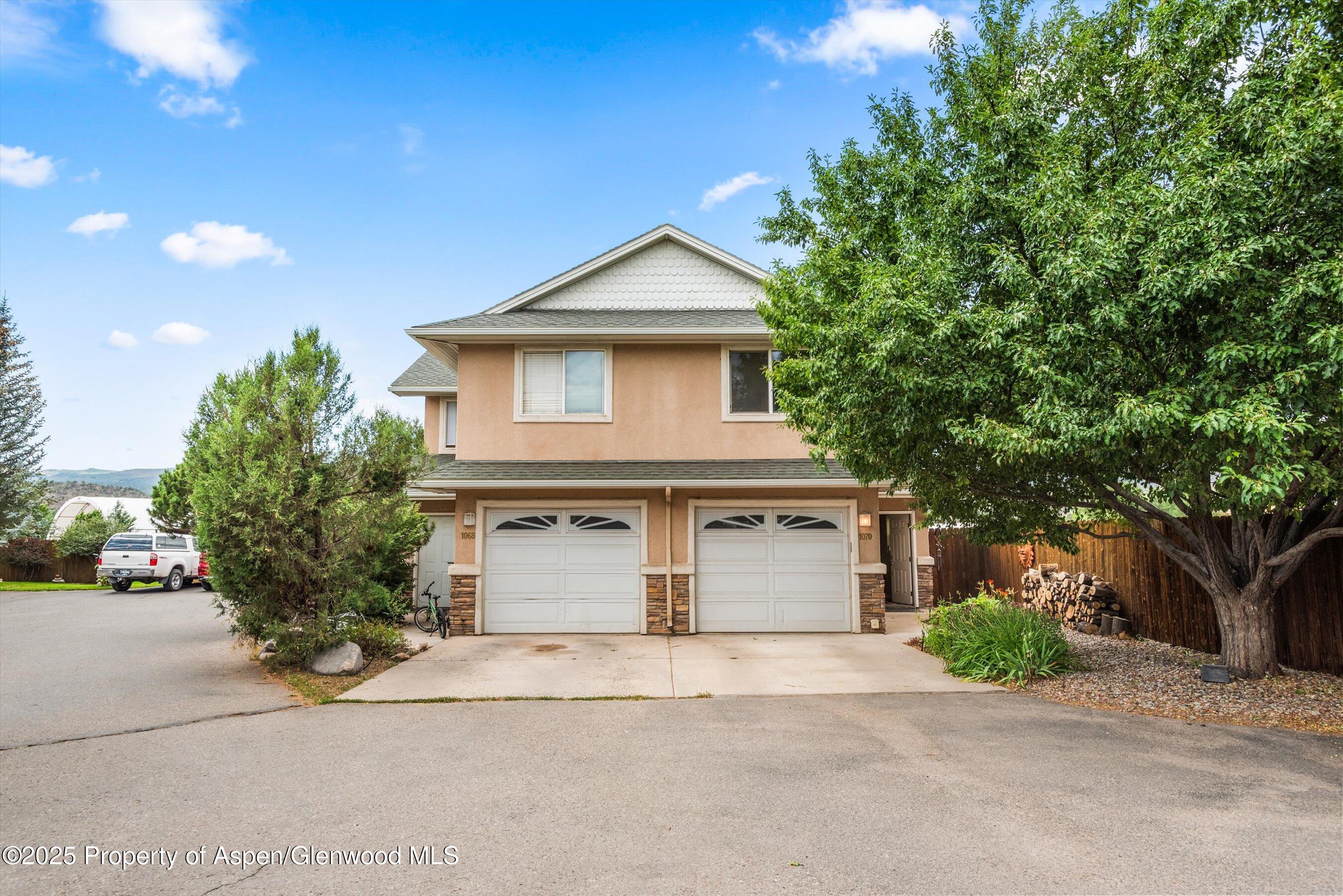 1070 Village Road Carbondale, CO 81623 - Photo 30 of 30 a front view of a house with a yard and garage