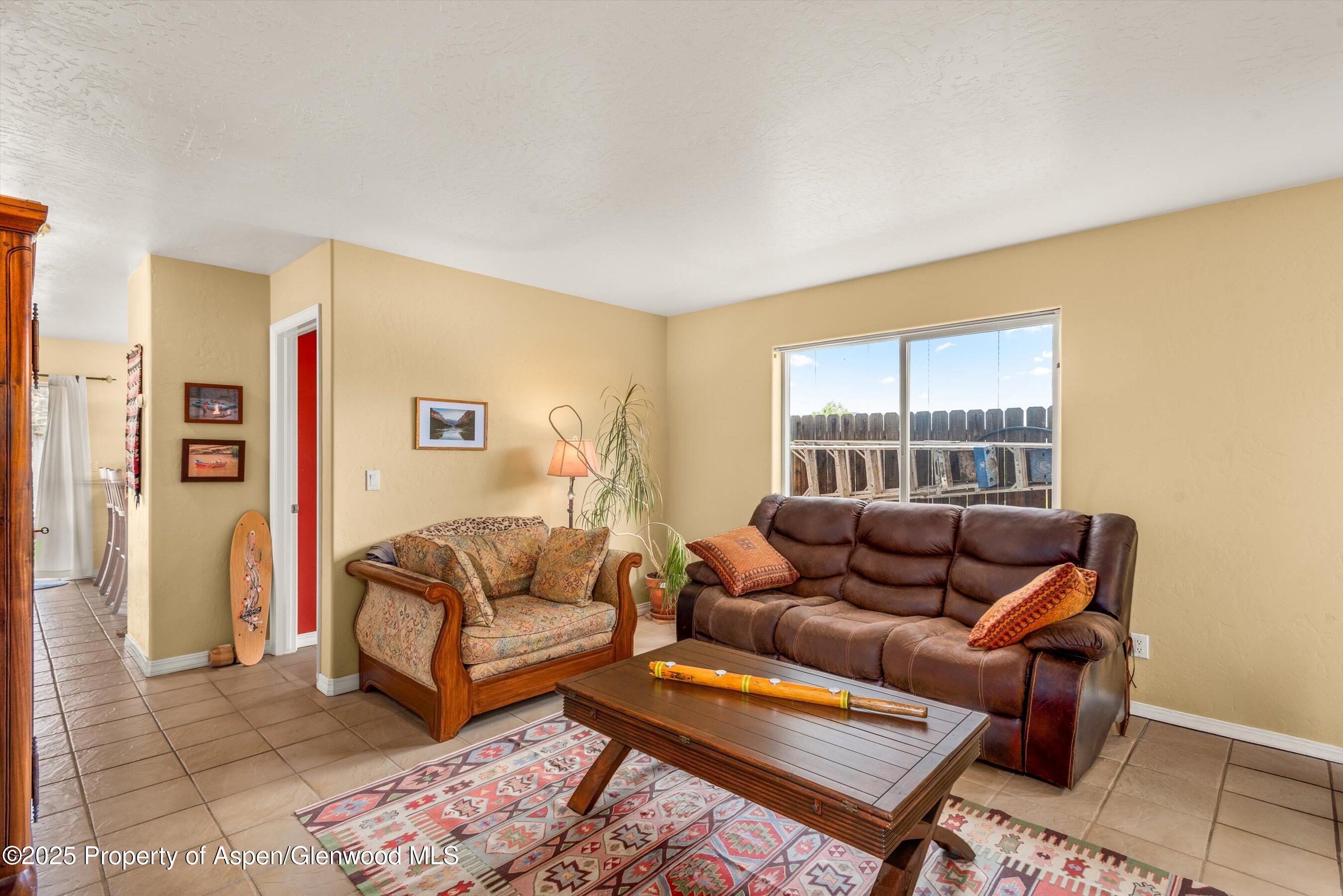1070 Village Road Carbondale, CO 81623 - Photo 7 of 30 a living room with furniture and a window