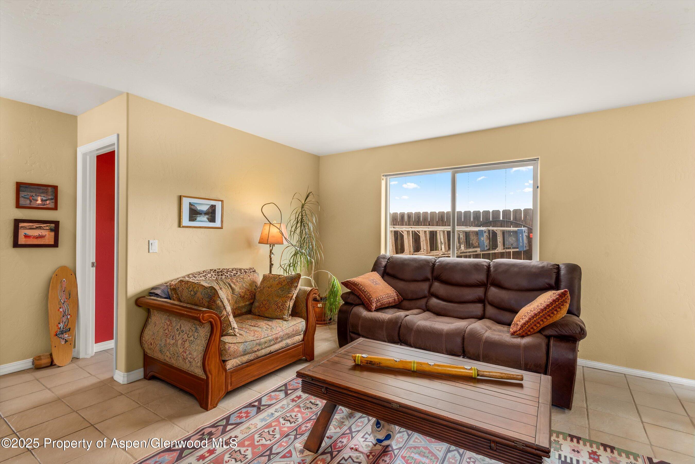 1070 Village Road Carbondale, CO 81623 - Photo 8 of 30 a living room with furniture and a window