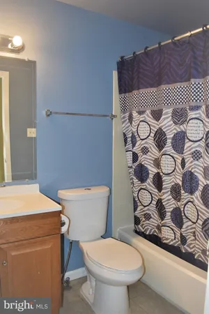 a bathroom with a toilet and a sink