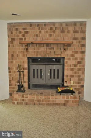 a living room with a fireplace