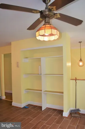 a room with a door and a chandelier