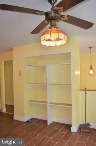 a room with a door and a chandelier