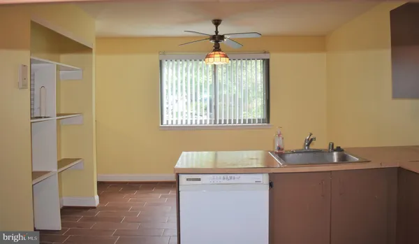 a room with a sink and a window