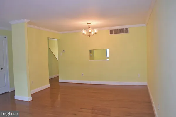 a view of a livingroom with wooden floor