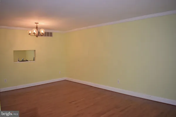 en empty room with a fan
