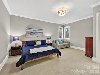 a bedroom with furniture and window