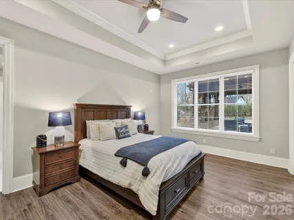 a kitchen view of a stove and chairs