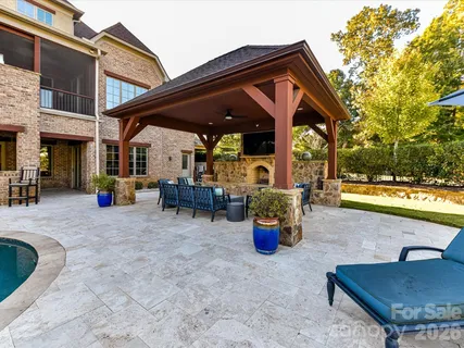 a view of swimming pool with outdoor seating and a terrace