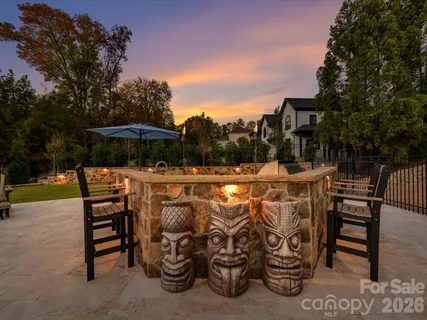 a outdoor living space with patio furniture and a fireplace