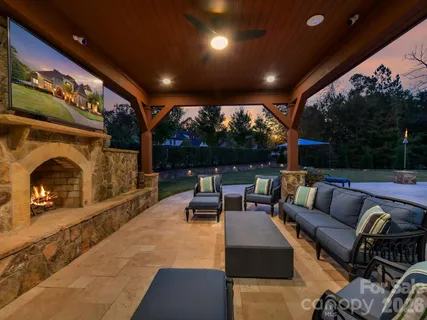 a view of a swimming pool with outdoor seating