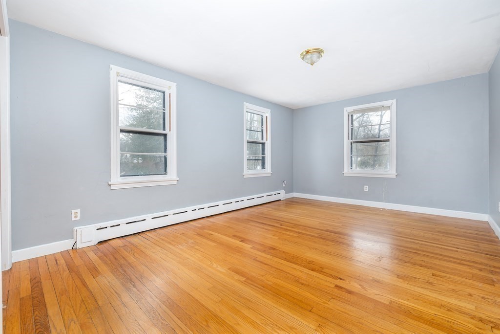 341 Converse Street Longmeadow, MA 01106 - Photo 15 of 34 a view of an empty room with wooden floor and a window