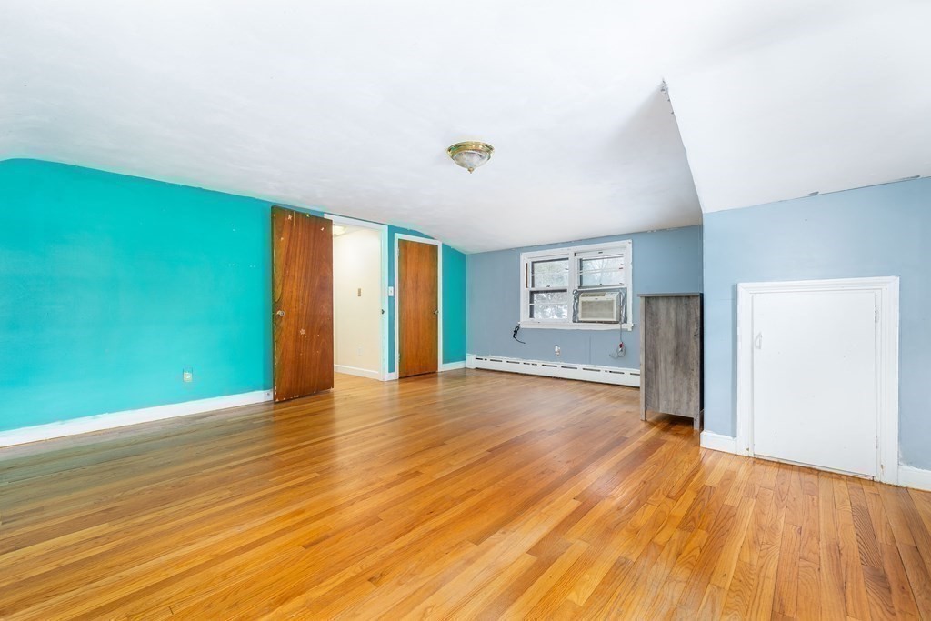341 Converse Street Longmeadow, MA 01106 - Photo 26 of 34 a view of an empty room with window and wooden floor
