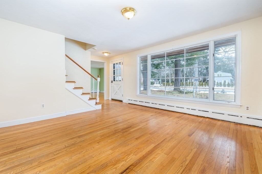 341 Converse Street Longmeadow, MA 01106 - Photo 4 of 34 a view of an empty room with wooden floor and a window