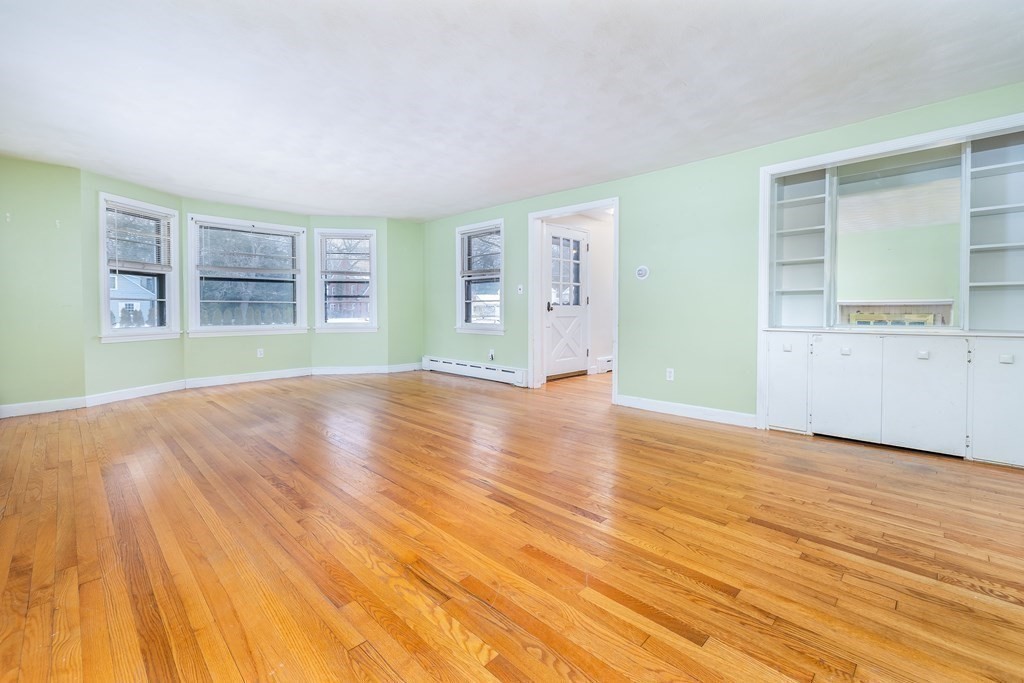 341 Converse Street Longmeadow, MA 01106 - Photo 7 of 34 an empty room with wooden floor and windows