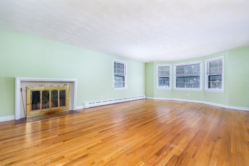 341 Converse Street Longmeadow, MA 01106 - Photo 8 of 34 a view of empty room with wooden floor and fan