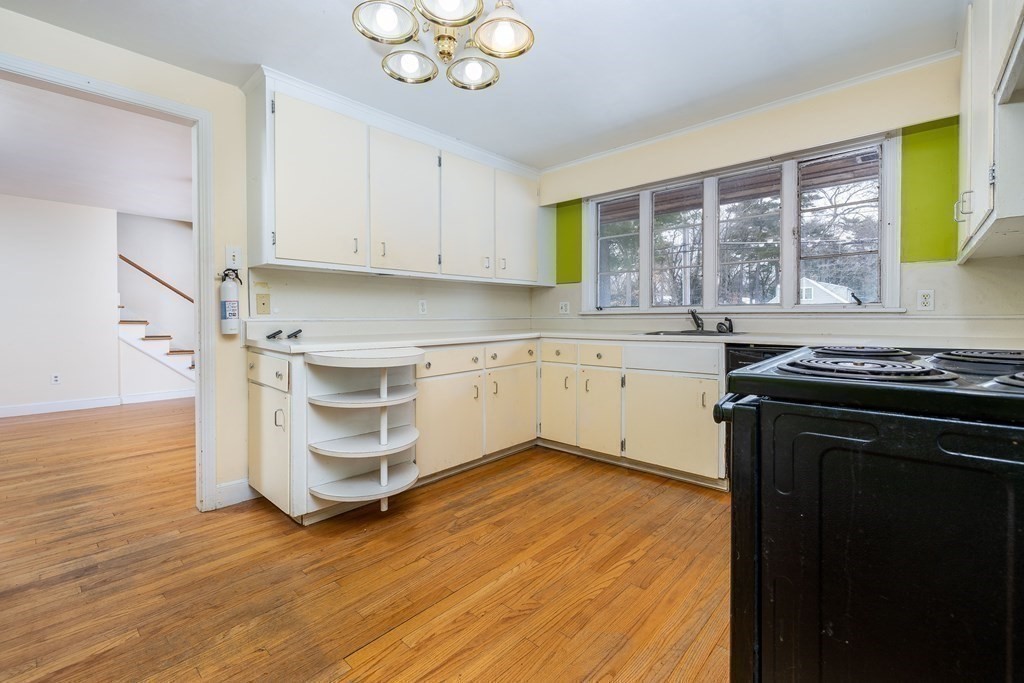 341 Converse Street Longmeadow, MA 01106 - Photo 9 of 34 a kitchen with stainless steel appliances granite countertop a stove a sink and a microwave