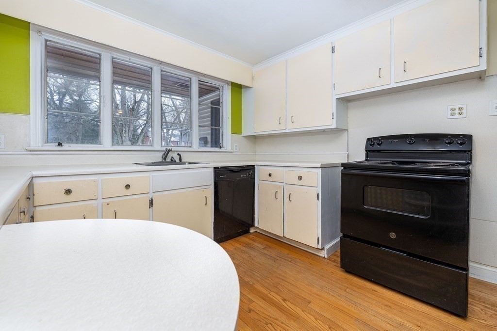 341 Converse Street Longmeadow, MA 01106 - Photo 10 of 34 a kitchen with a stove a sink and a window