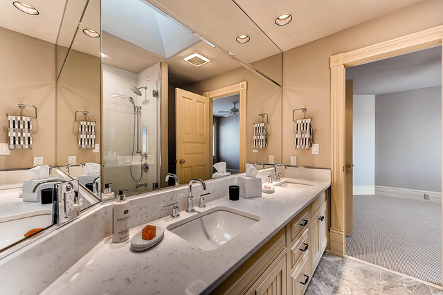 37W634 Grey Barn Road St. Charles, IL 60175 - Photo 27 of 37 a bathroom with a double vanity sink and a mirror