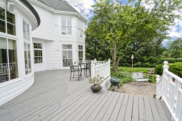 37W634 Grey Barn Road St. Charles, IL 60175 - Photo 34 of 37 a view of a deck with table and chairs and wooden floor