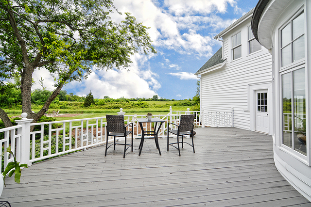 37W634 Grey Barn Road St. Charles, IL 60175 - Photo 35 of 37 a view of a roof deck with table and chairs and wooden floor